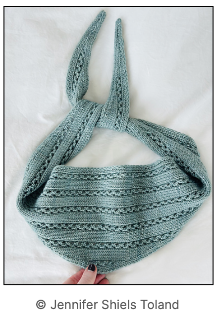 Image of the shawlette flat layed on a white background