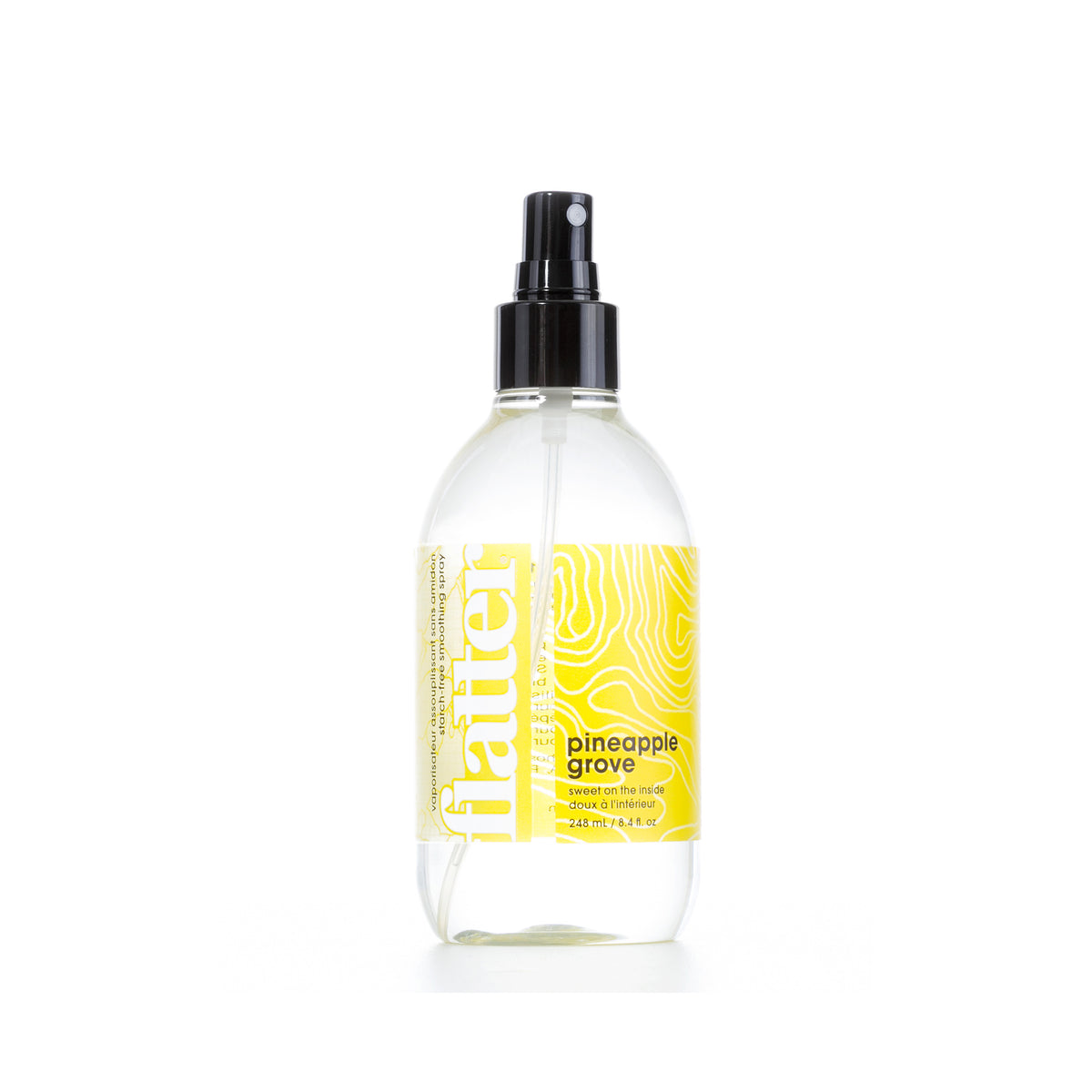 Clear spray bottle with yellow label on a white background