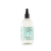 Spray bottle with a label on a white background