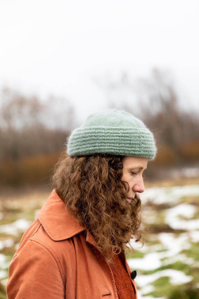 image of a knit hat being worn on a person outdoors
