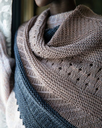 close up of a shawl near a window