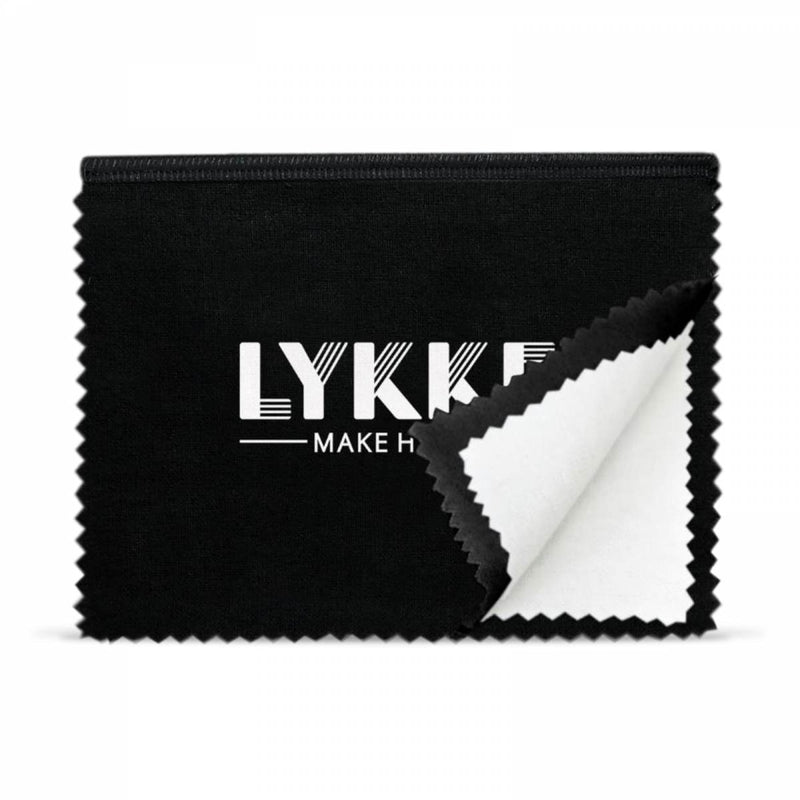 Metal Polishing cloth that is black on the outside with the words lykke make happy in white lettering