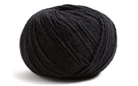 Black ball of yarn on white background