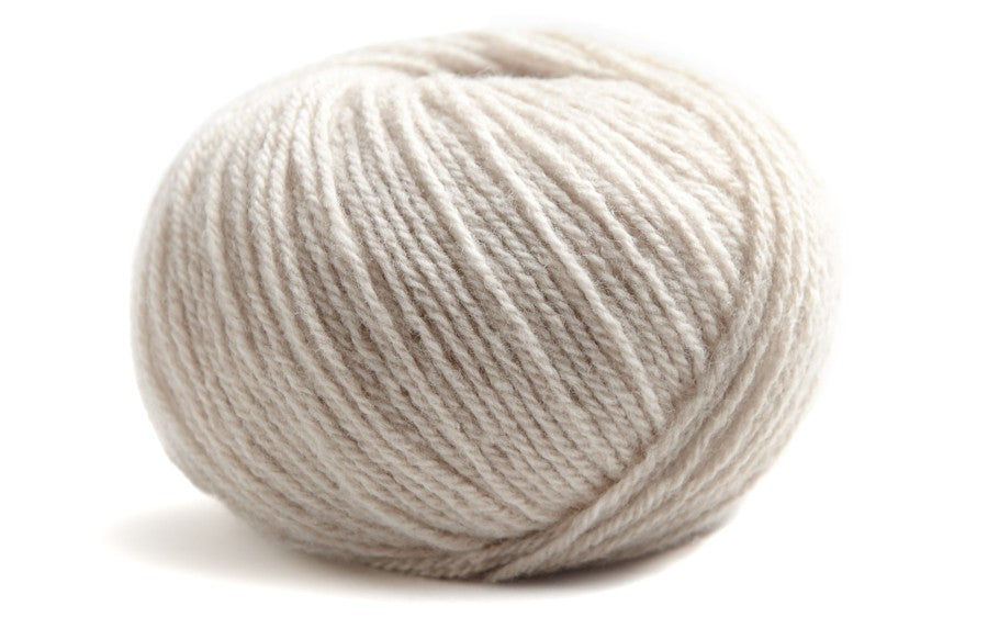 light grey ball of yarn on a white background