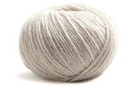 light grey ball of yarn on a white background