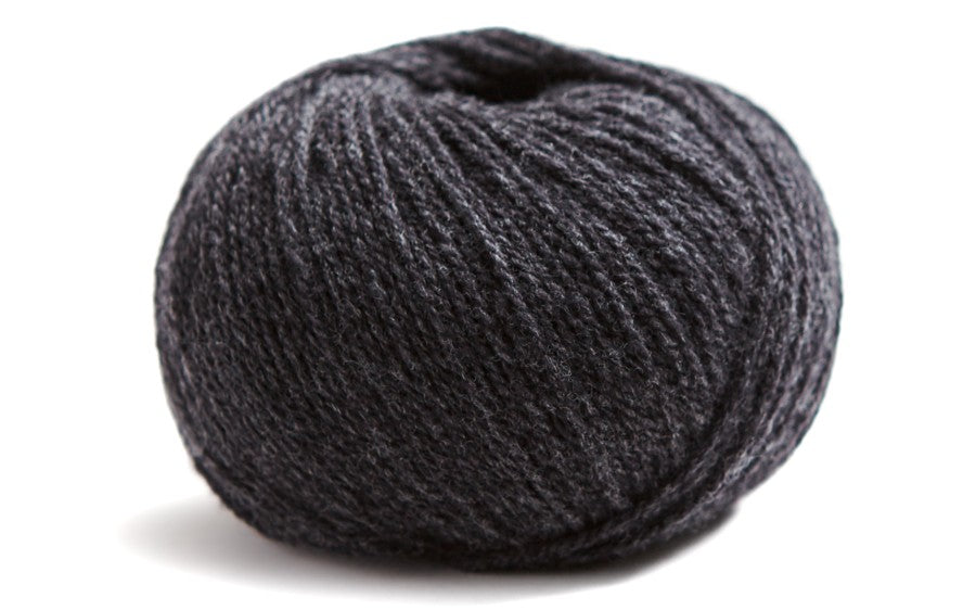 dark grey ball of yarn on a white background