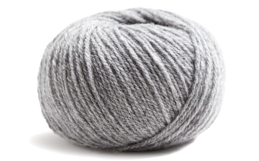 medium grey ball of yarn on a white background