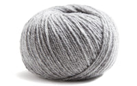 medium grey ball of yarn on a white background