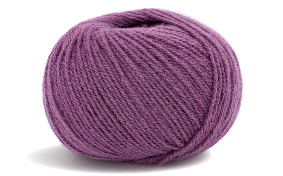 purple coloured ball of yarn on a white background