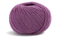 purple coloured ball of yarn on a white background