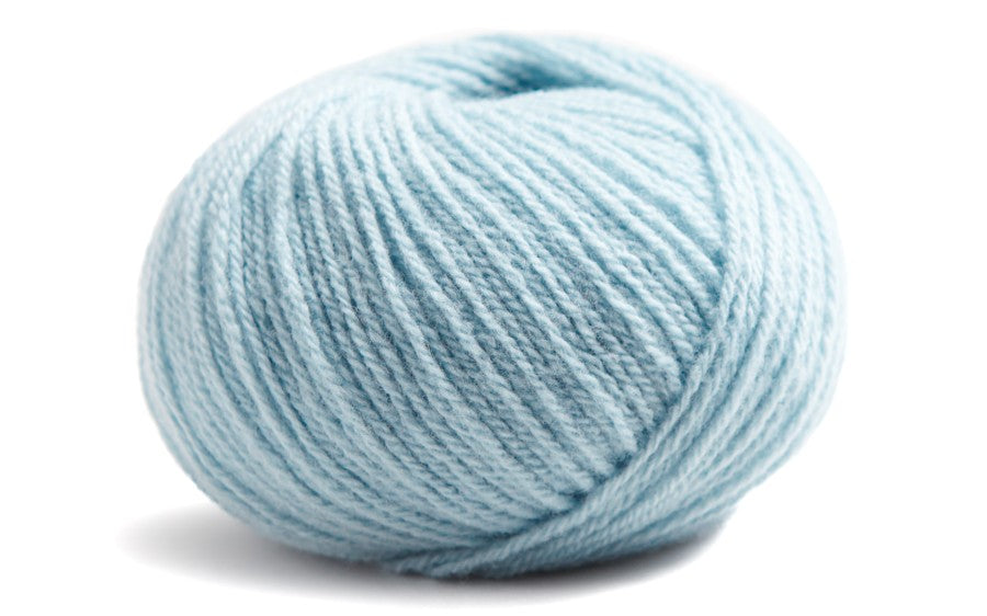 light blue coloured ball of yarn on a white background