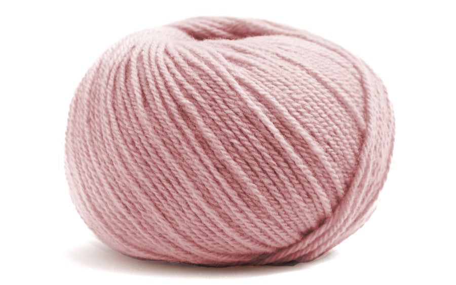 light pink coloured ball of yarn on a white background