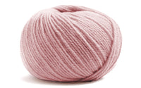 light pink coloured ball of yarn on a white background