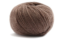 light brown coloured ball of yarn on a white background