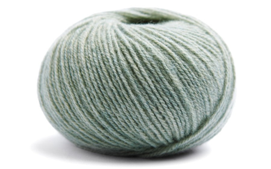 light greenish blue coloured ball of yarn on a white background