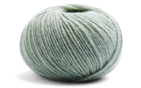 light greenish blue coloured ball of yarn on a white background