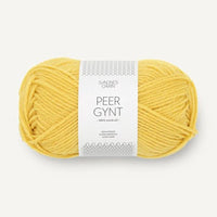 A ball of yellow yarn on a white background