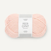 a ball of light pink yarn on a white background