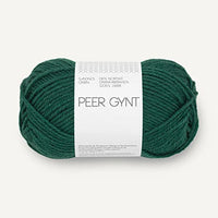 A skein of dark green yarn with a white paper label reading 'PEER GYNT' on a light gray background.