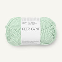 a ball of pale mint green yarn on a white background