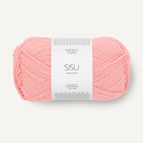A skein of light pink yarn with a white paper label