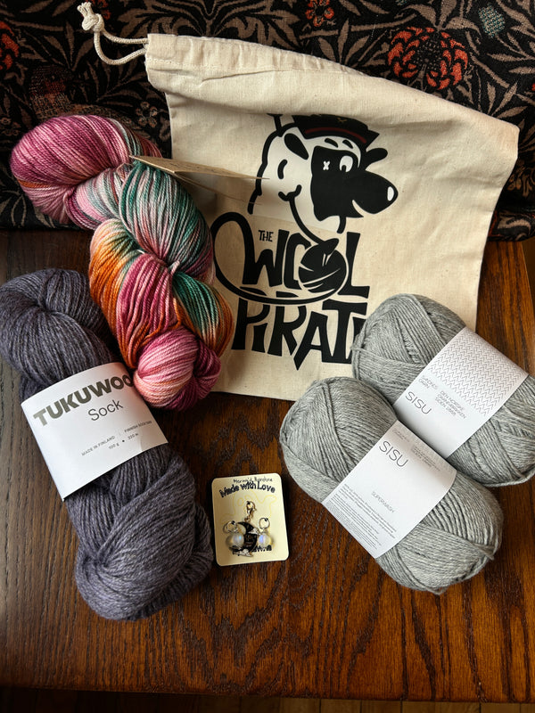 Limited Edition Socktober bundle example containing project bag, stitch markers, alegria, tukuwool sock and sisu yarns.