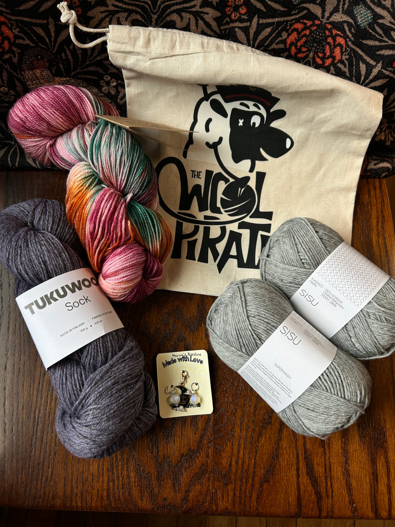 Limited Edition Socktober bundle example containing project bag, stitch markers, alegria, tukuwool sock and sisu yarns.