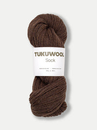 skein of brown yarn against a white background