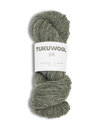 A skein of Tukuwool DK yarn in a heathered sage green color, wrapped with a white paper label, on a white background.
