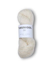 A skein of cream-colored Tukuwool DK yarn with a white paper label, centered on a white background.