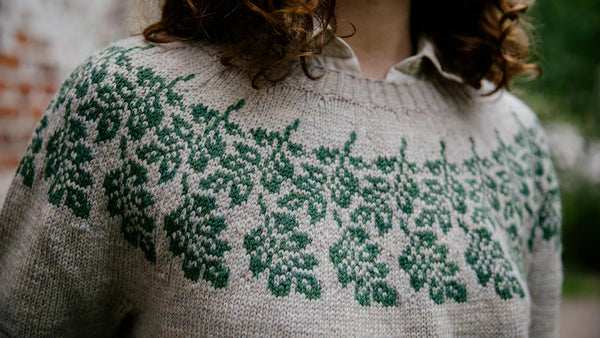 close up of the colourwork yoke on a knit sweater being worn by the designer