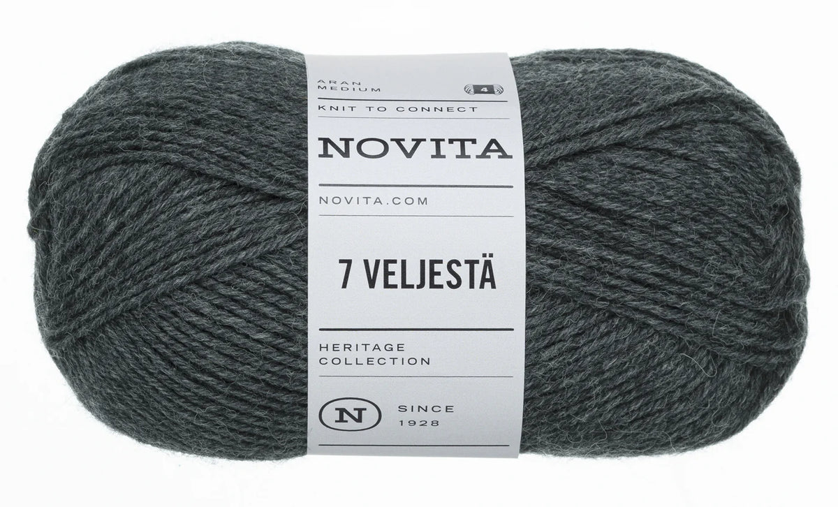 A skein of dark heather gray yarn with a white paper label reading 'NOVITA' and '7 VELJESTÄ', photographed on a plain white background.