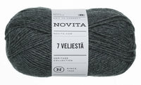 A skein of dark heather gray yarn with a white paper label reading 'NOVITA' and '7 VELJESTÄ', photographed on a plain white background.